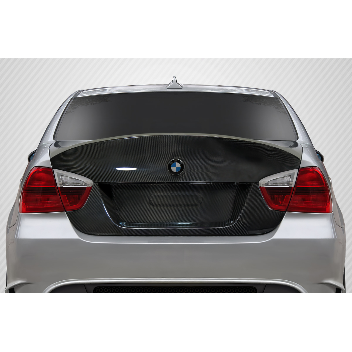 Modify your BMW 3-Series 2006 with our Exterior/Trunks - Rear view angle showing carbon fiber trunk lid