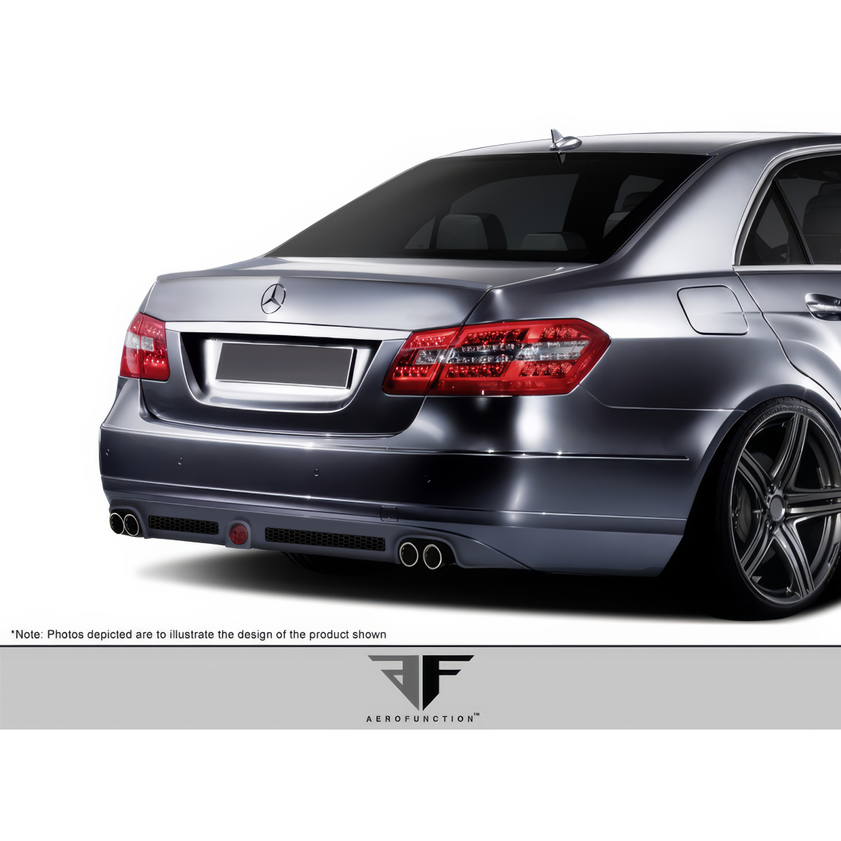 Modify your Mercedes-Benz E-Class 2010 with our Exterior/Rear Bumpers or Lips - Rear view angle of vehicle showing the bumper design