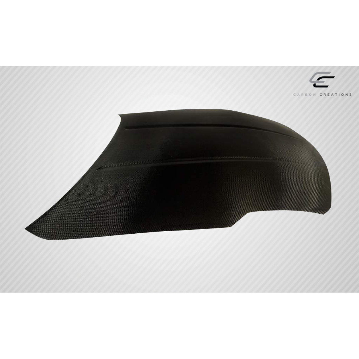 Modify your Nissan 350Z 2003 with our Exterior/Hoods - Angle view of a carbon fiber hood part