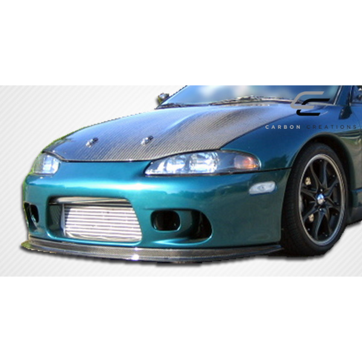 Modify your Eagle Talon 1995 with our Exterior/Hoods - Front angle view of the vehicle's hood