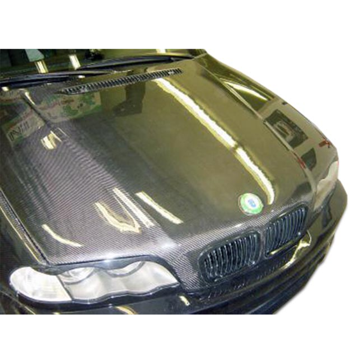 Modify your BMW 3-Series 1999 with our Exterior/Hoods - Hood viewed from a top down angle with reflections