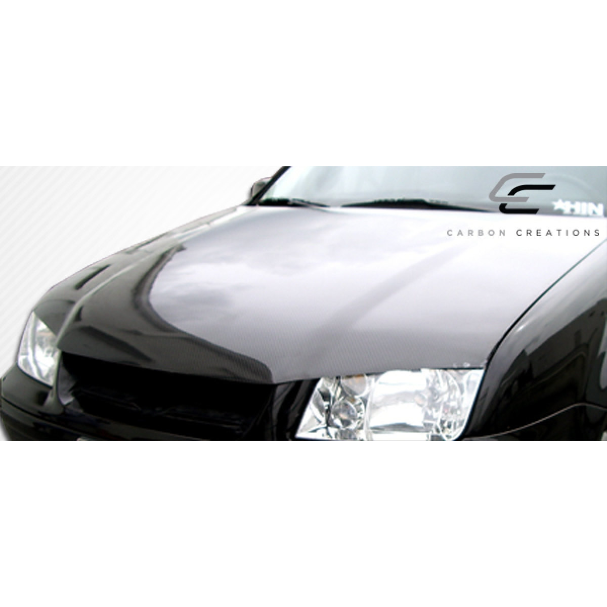 Modify your Volkswagen Jetta 1999 with our Exterior/Hoods - Front angled view of carbon fiber hood