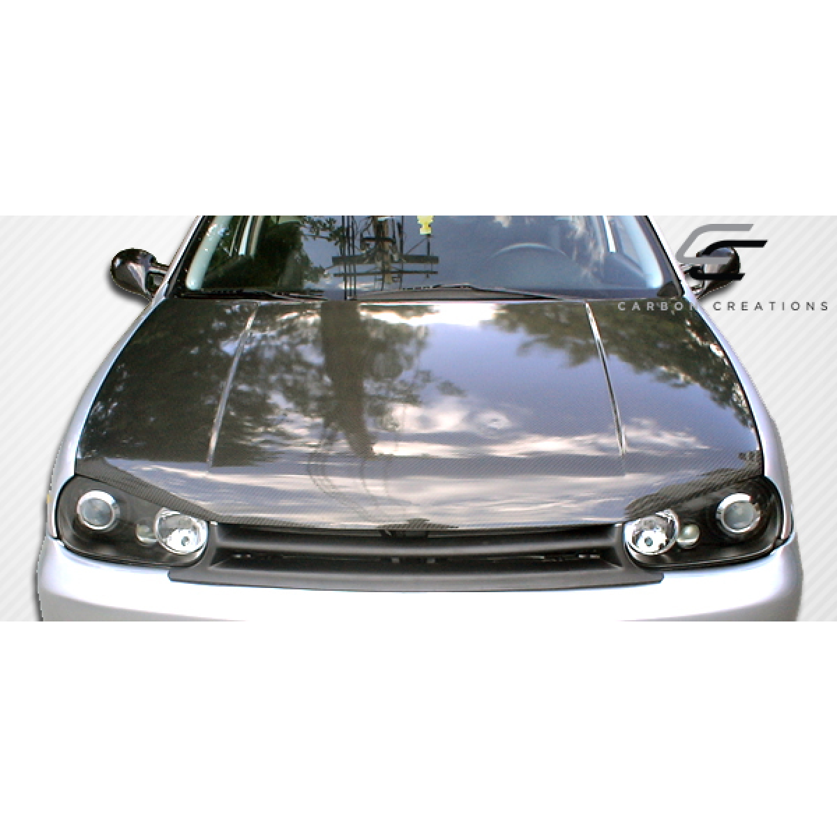 Modify your Volkswagen Golf 1999 with our Exterior/Hoods - Front view of carbon fiber hood at 0 degrees