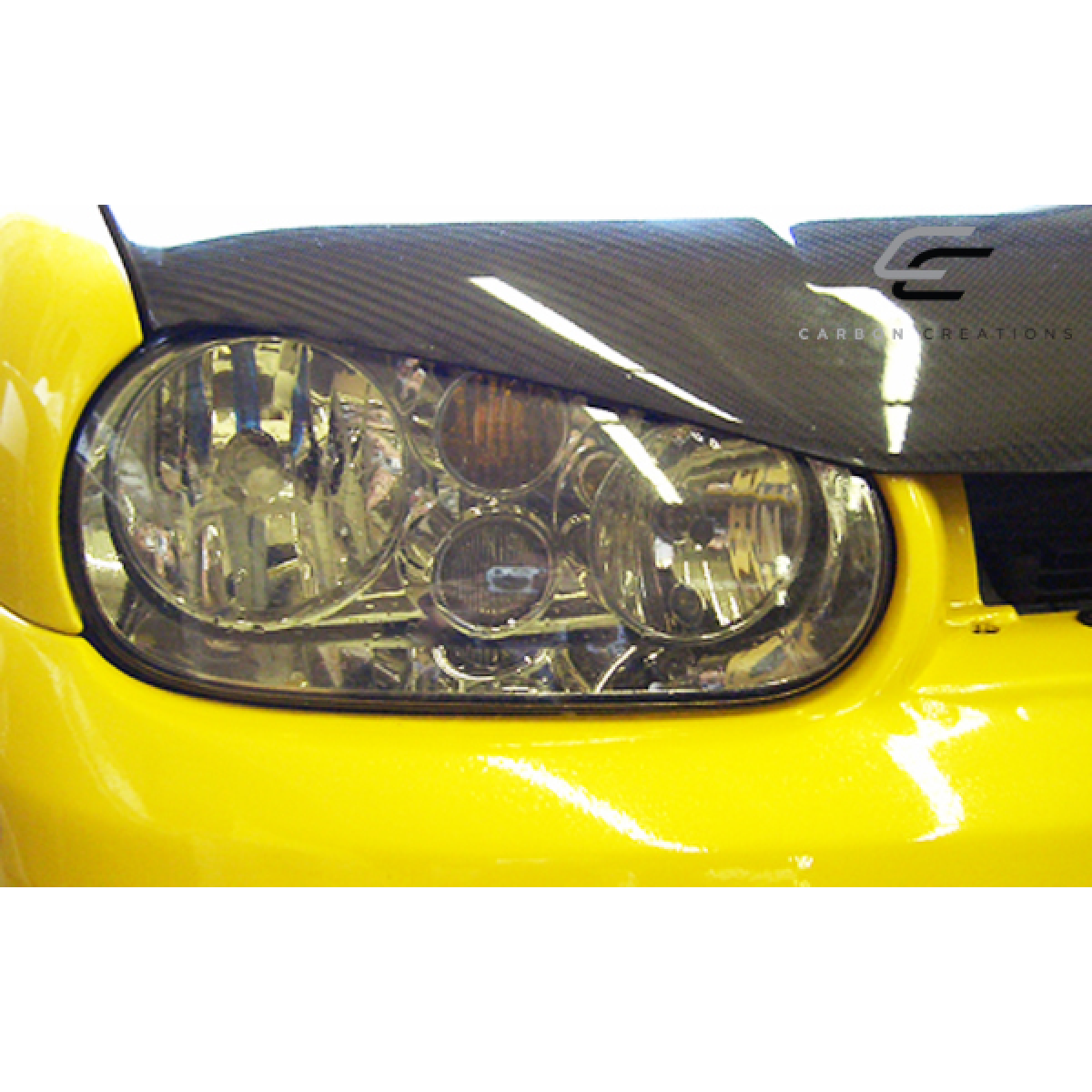 Modify your Volkswagen Golf 1999 with our Exterior/Hoods - Front view of hood at a slight angle