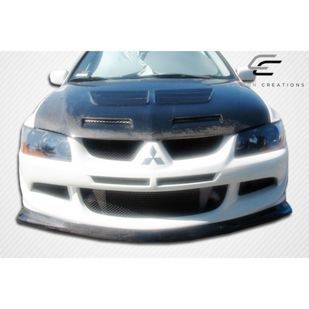 Modify your Mitsubishi Evolution 2003 with our Exterior/Front Bumpers or Lips - Front angle view of a modified car part