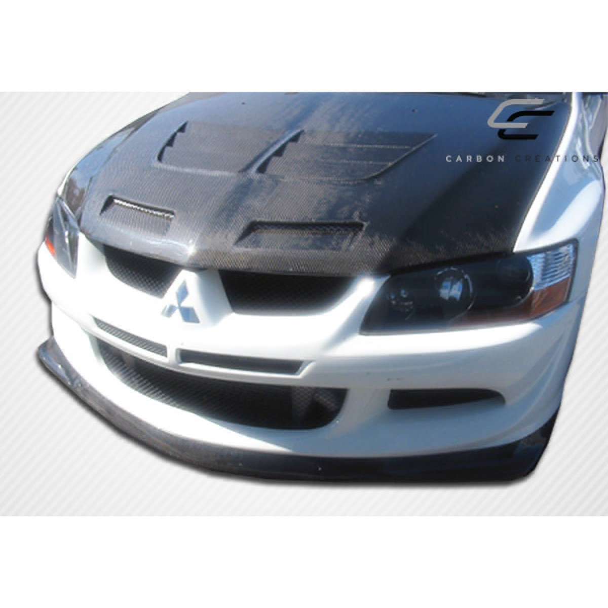 Modify your Mitsubishi Evolution 2003 with our Exterior/Front Bumpers or Lips - Front view angle of carbon fiber front lip