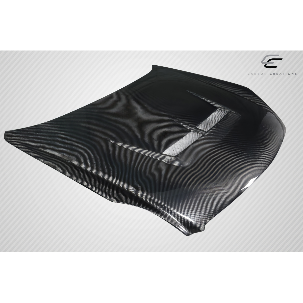 Modify your Infiniti G35 2003 with our Exterior/Hoods - Angled view of a carbon fiber hood part