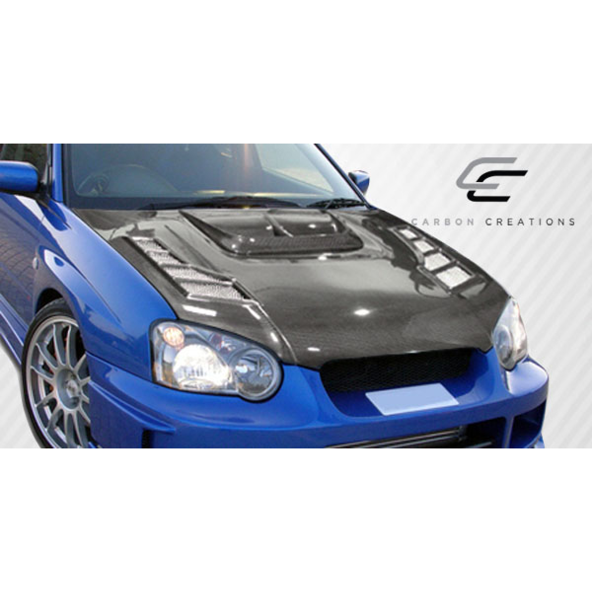 Modify your Subaru Impreza 2004 with our Exterior/Hoods - The angle shows the hood from a front view perspective