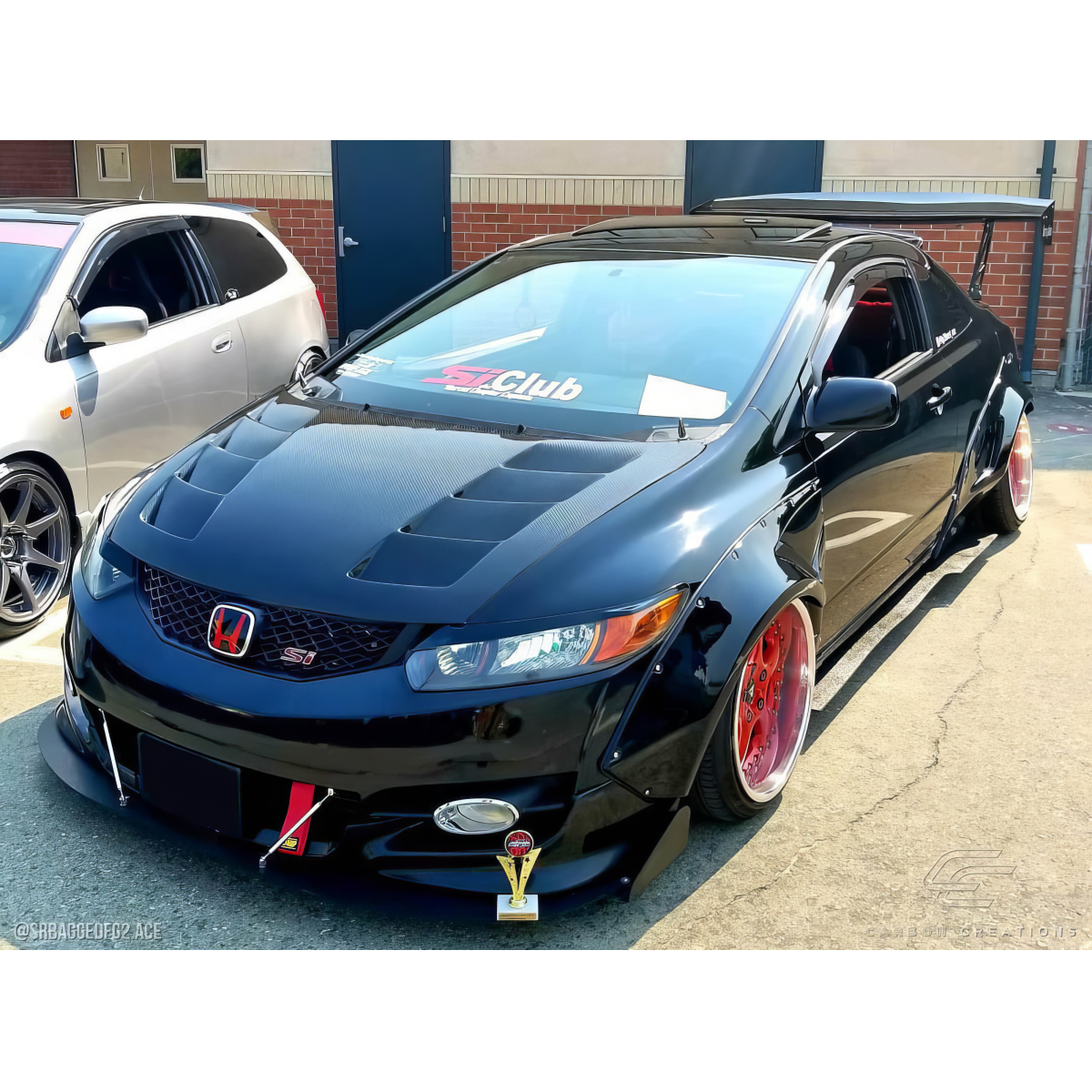 Modify your Honda Civic 2006 with our Exterior/Hoods - Front three quarter view of a modified Honda Civic