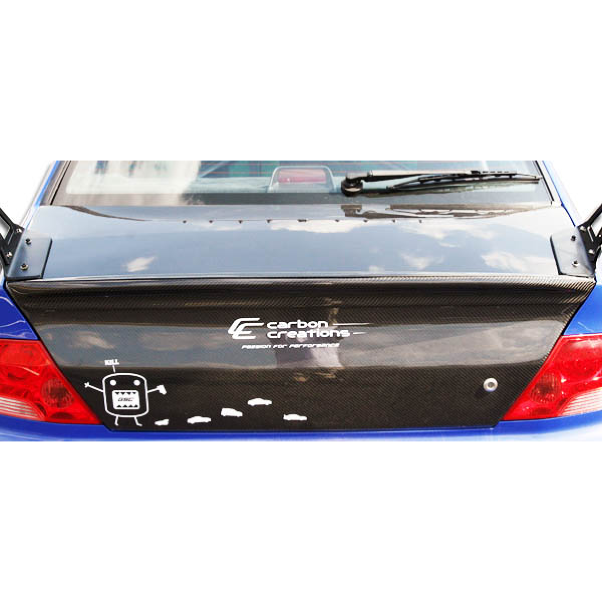 Modify your Mitsubishi Evolution 2002 with our Exterior/Trunks - Rear view angle of car trunk spoiler part