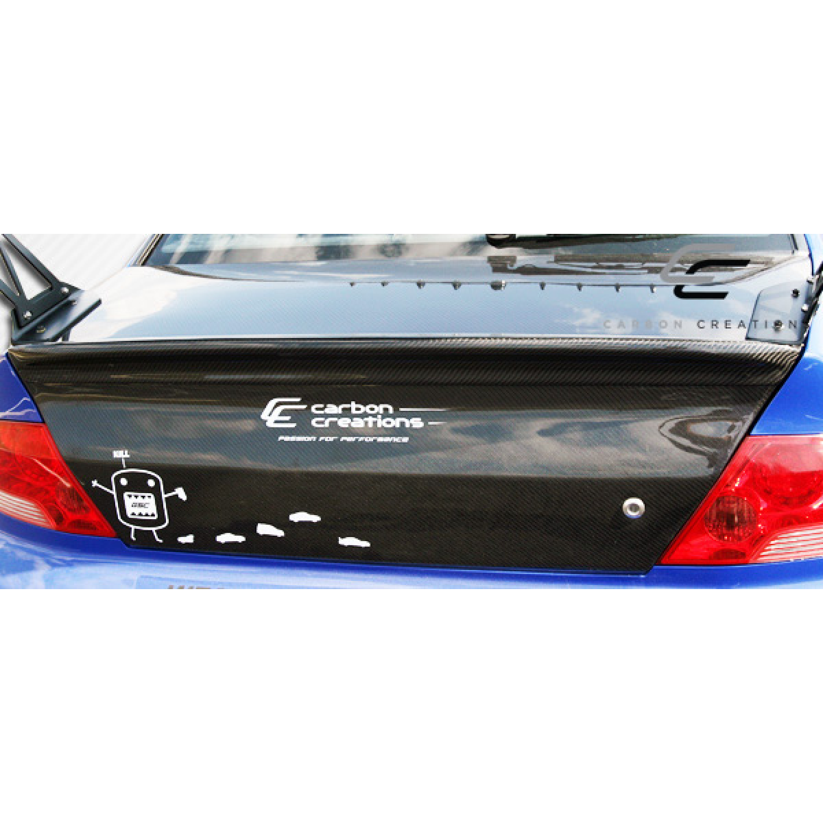 Modify your Mitsubishi Evolution 2002 with our Exterior/Trunks - Rear view of carbon fiber trunk at a slight angle