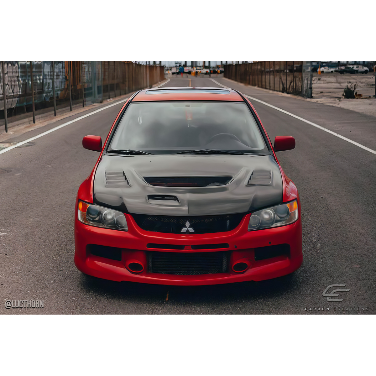 Modify your Mitsubishi Evolution 2003 with our Exterior/Hoods - Front view of car hood at eye level angle