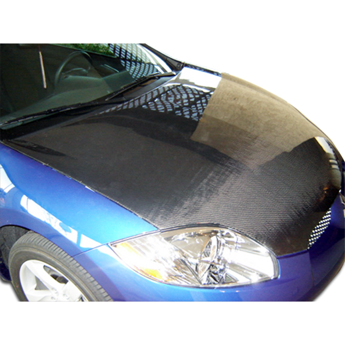 Modify your Mitsubishi Eclipse 2006 with our Exterior/Hoods - Front view of vehicle hood at slight angle