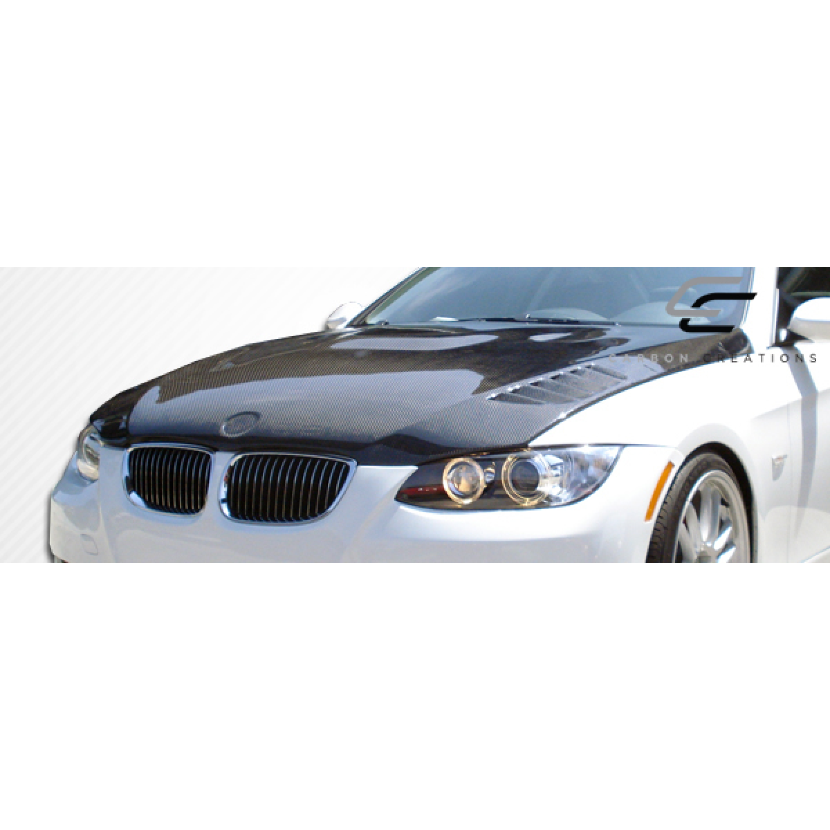 Modify your BMW 3-Series 2007 with our Exterior/Hoods - Front view showing carbon fiber hood design