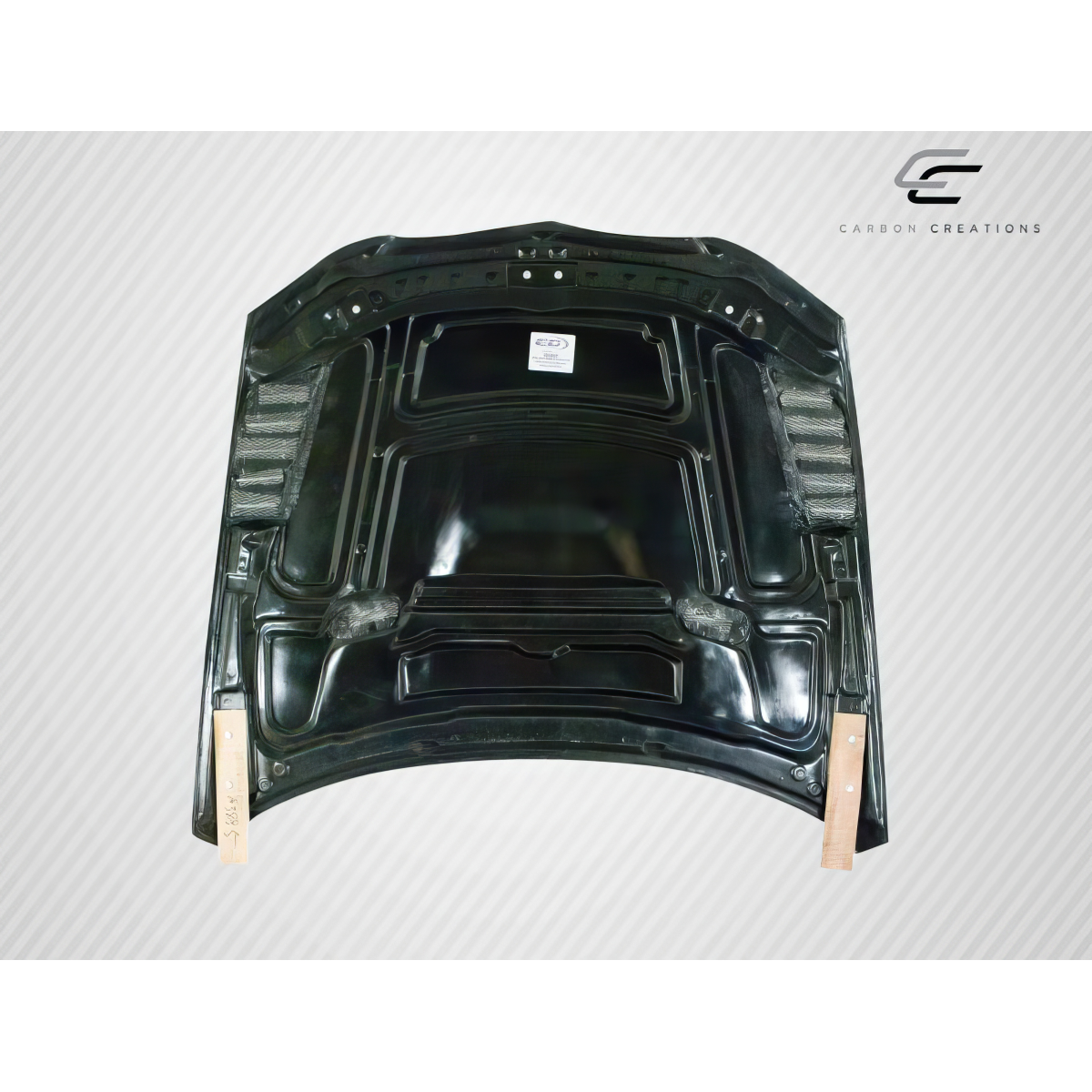 Modify your BMW 3-Series 2007 with our Exterior/Hoods - Top view of carbon fiber hood at flat angle