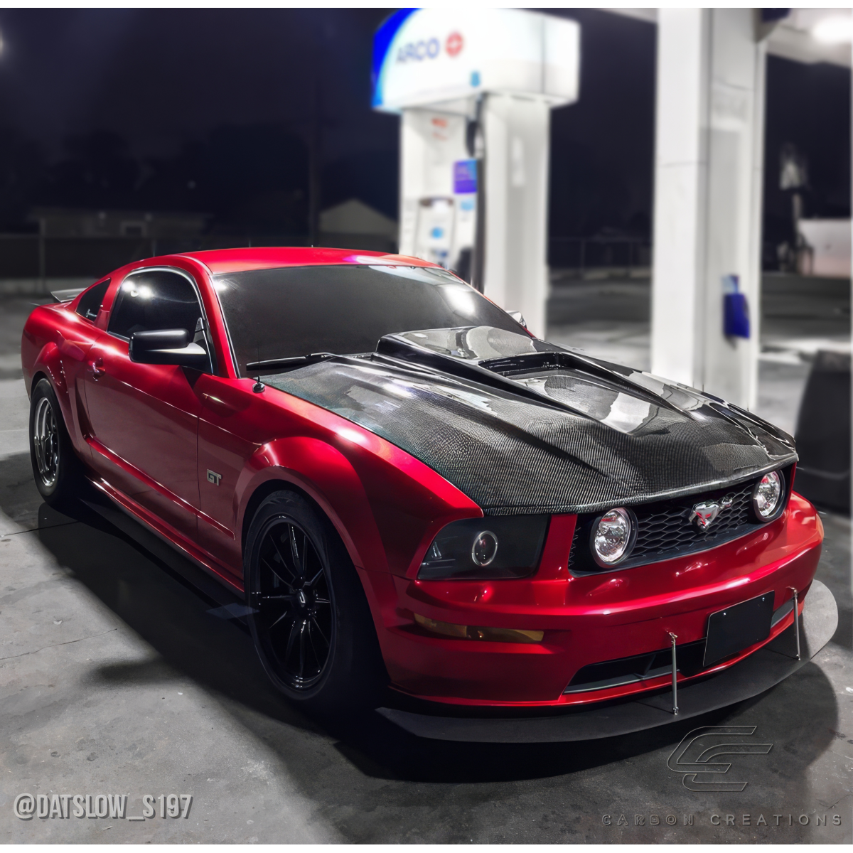 Modify your Ford Mustang 2005 with our Exterior/Hoods - Image viewed at a front quarter angle