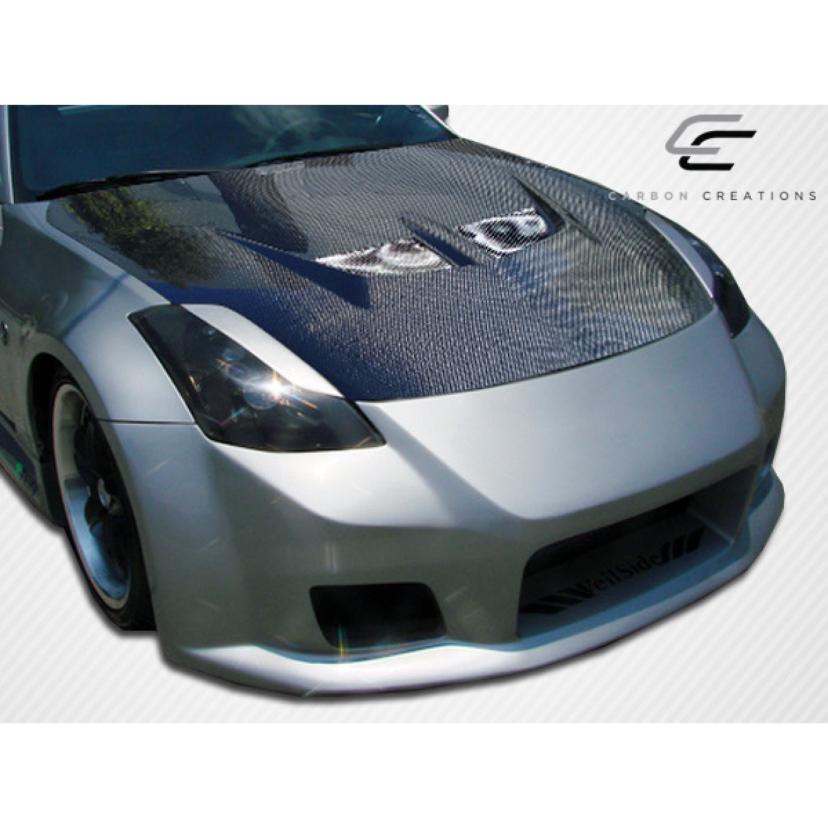 Modify your Nissan 350Z 2003 with our Exterior/Hoods - Front angle showcasing carbon fiber hood design