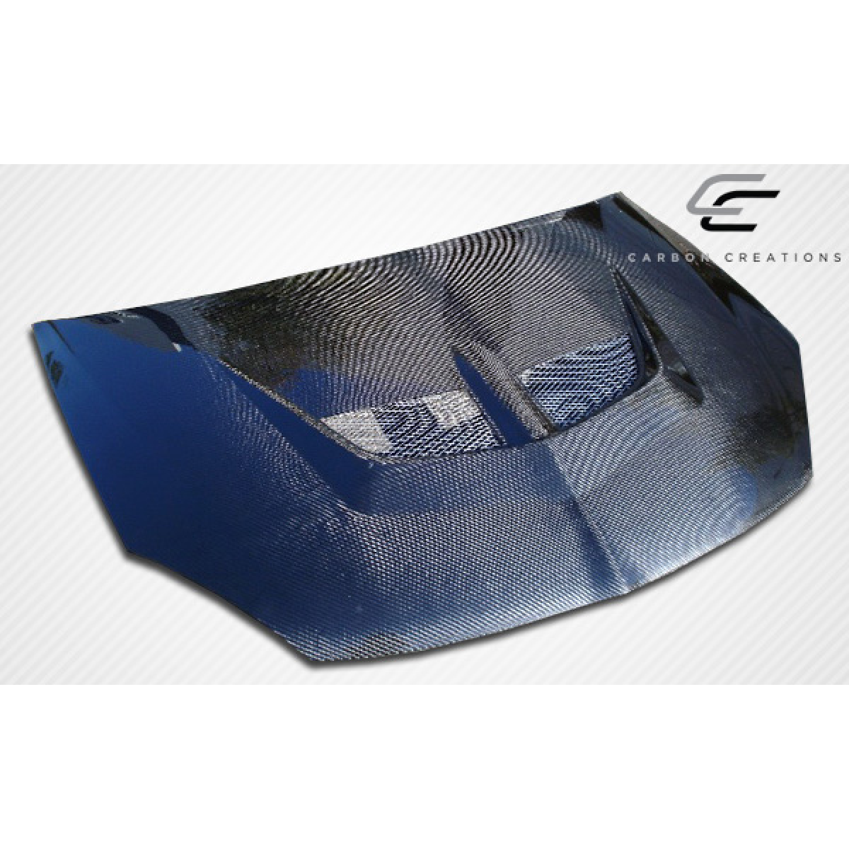 Modify your Mitsubishi Lancer 2004 with our Exterior/Hoods - Angled view showing the carbon fiber hood design