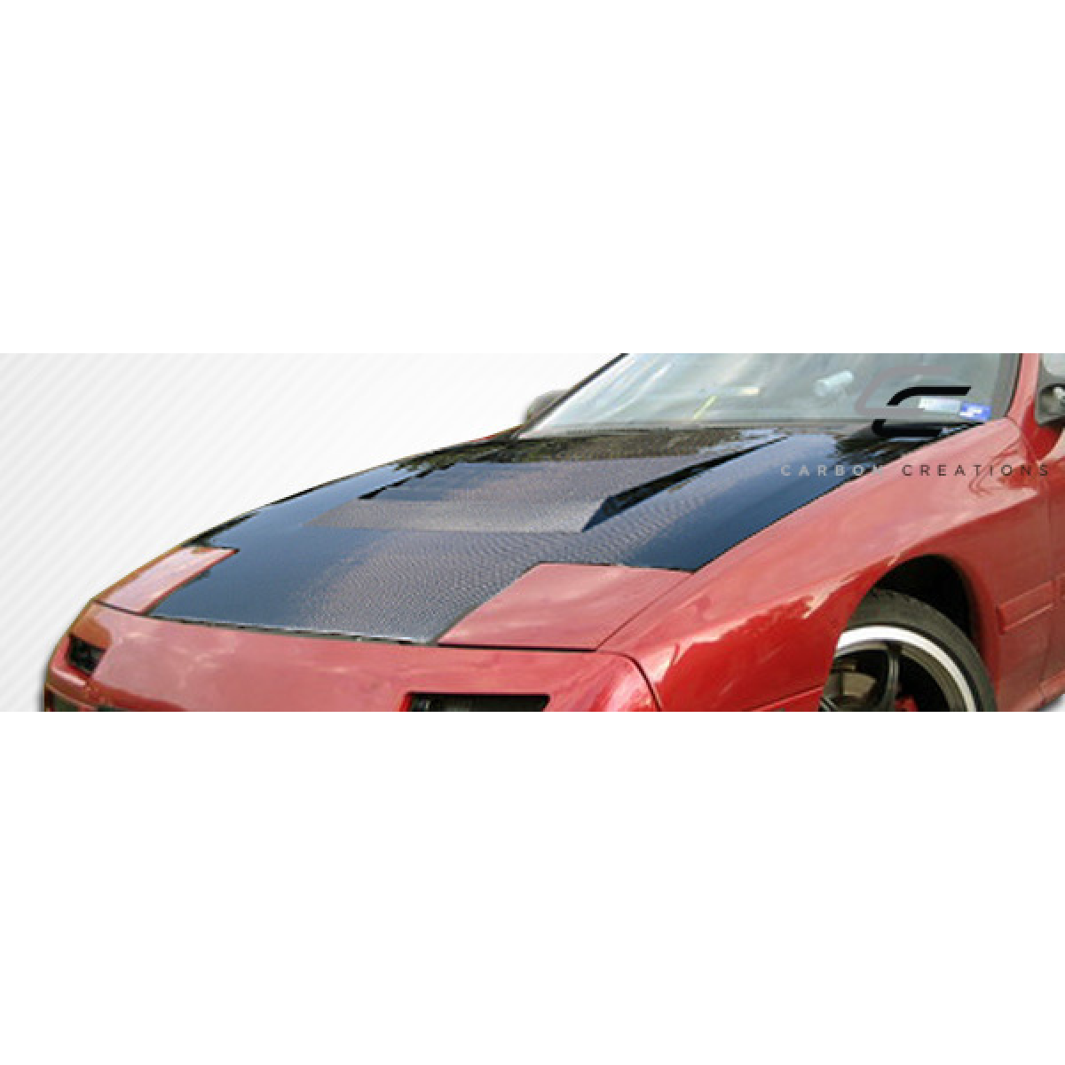 Modify your Mazda RX-7 1986 with our Exterior/Hoods - Front angle focused on carbon fiber hood