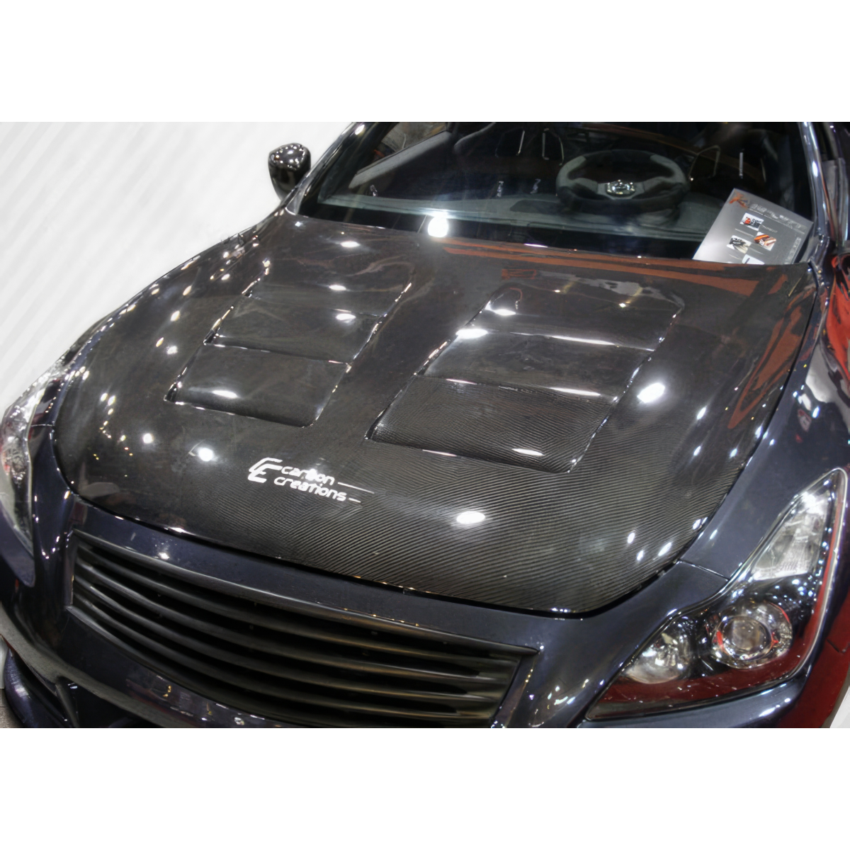 Modify your Infiniti G37 2008 with our Exterior/Hoods - Top down view of carbon fiber hood