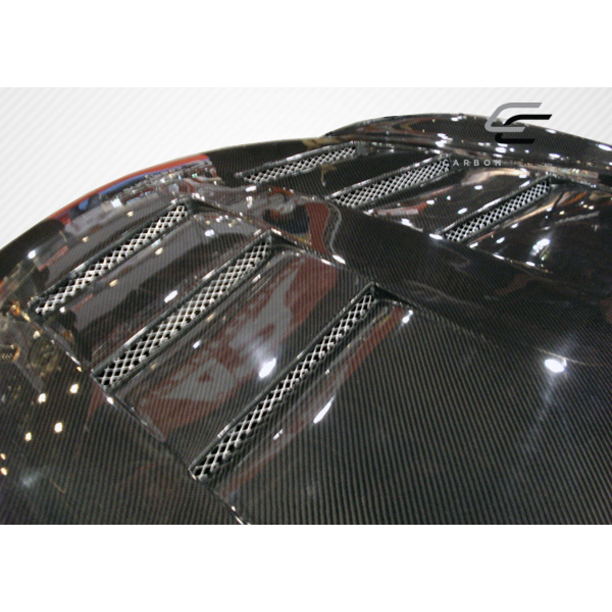 Modify your Infiniti G37 2008 with our Exterior/Hoods - Top view of carbon fiber hood at slight angle