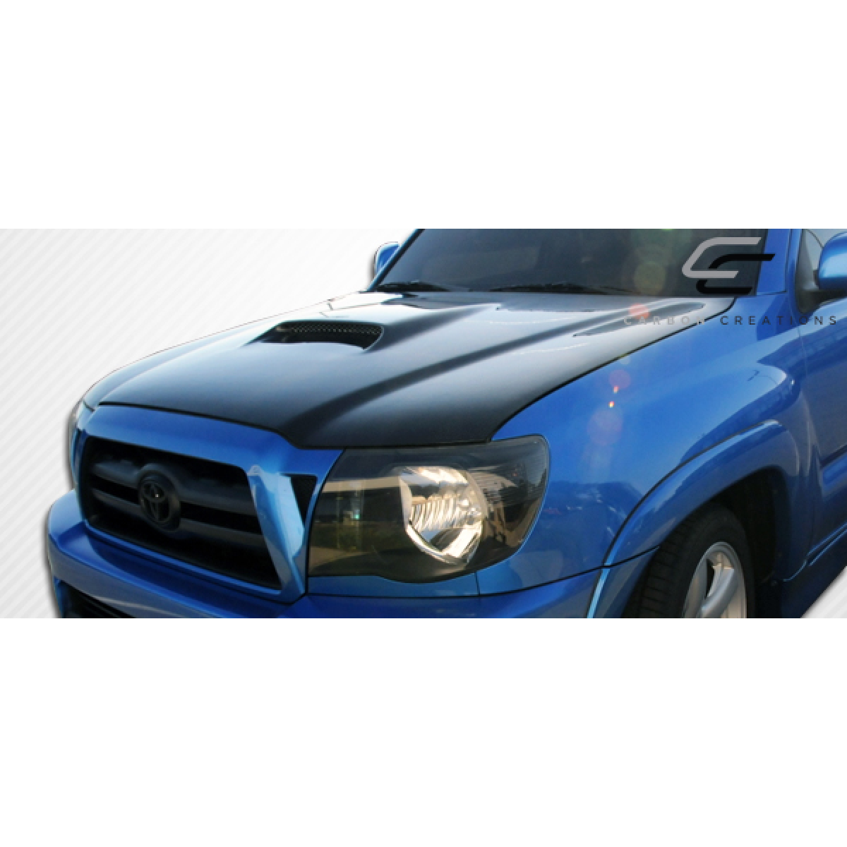 Modify your Toyota Tacoma 2005 with our Exterior/Hoods - Angled view of vehicle hood from the front