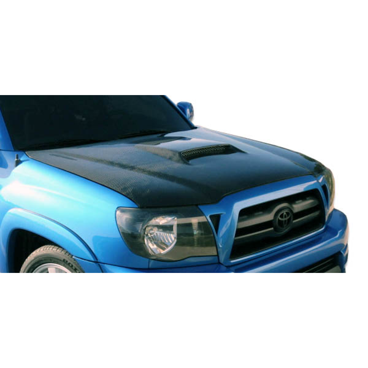 Modify your Toyota Tacoma 2005 with our Exterior/Hoods - Front angled view of carbon fiber hood