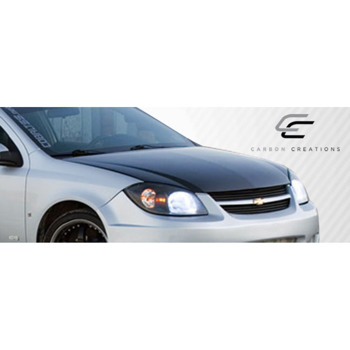 Modify your Chevrolet Cobalt 2005 with our Exterior/Hoods - Front angle of vehicle showing hood design