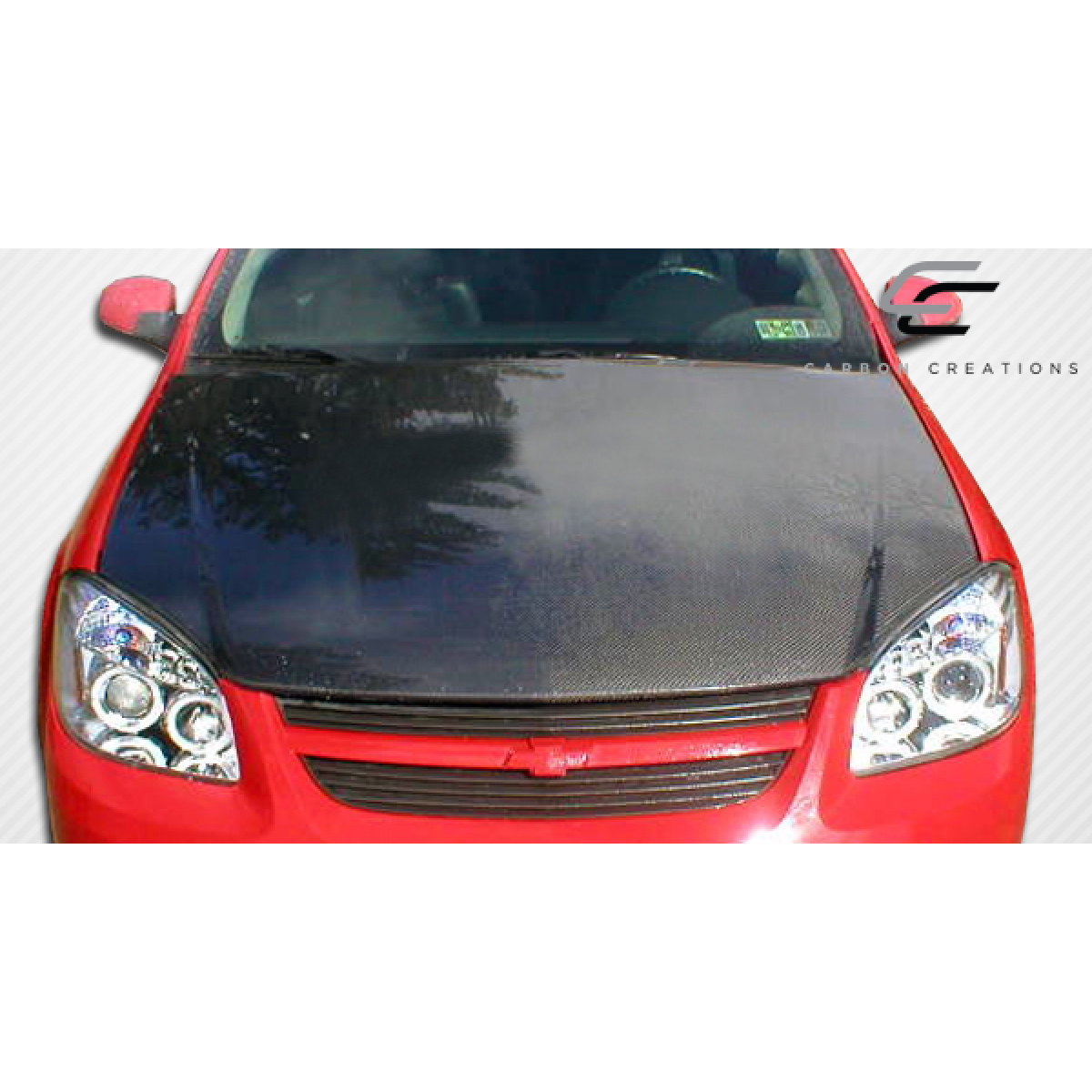 Modify your Chevrolet Cobalt 2005 with our Exterior/Hoods - Front view of carbon fiber hood on red vehicle