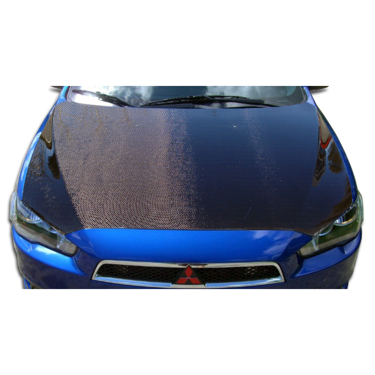 Modify your Mitsubishi Evolution 2008 with our Exterior/Hoods - Top view of a car hood with carbon fiber finish