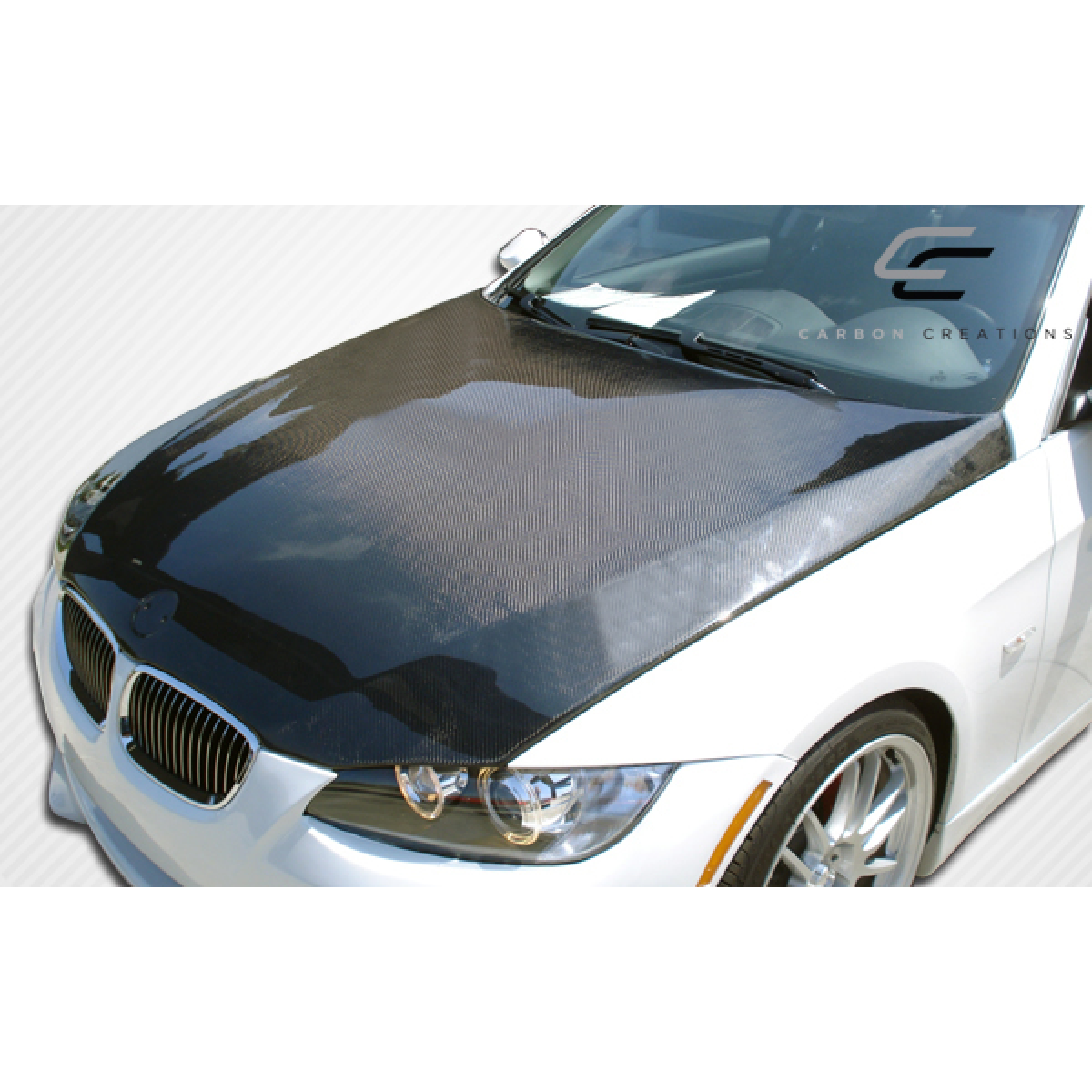 Modify your BMW 3-Series 2007 with our Exterior/Hoods - Top angle view of carbon fiber hood on BMW 3 Series