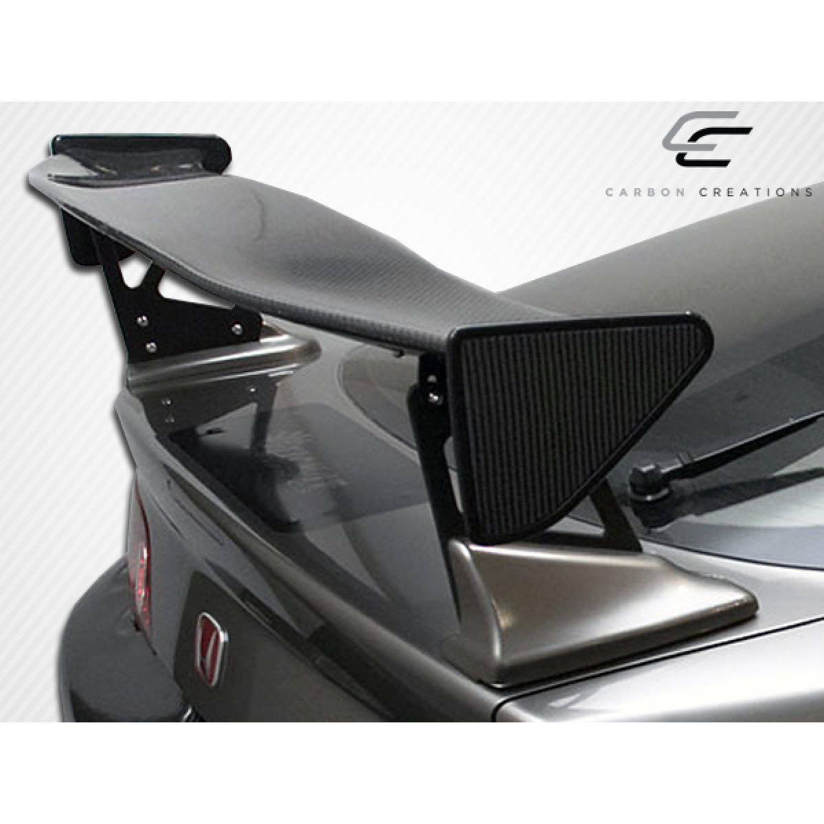Modify your Acura RSX 2002 with our Exterior/Wings - Rear angled view of a car wing spoiler