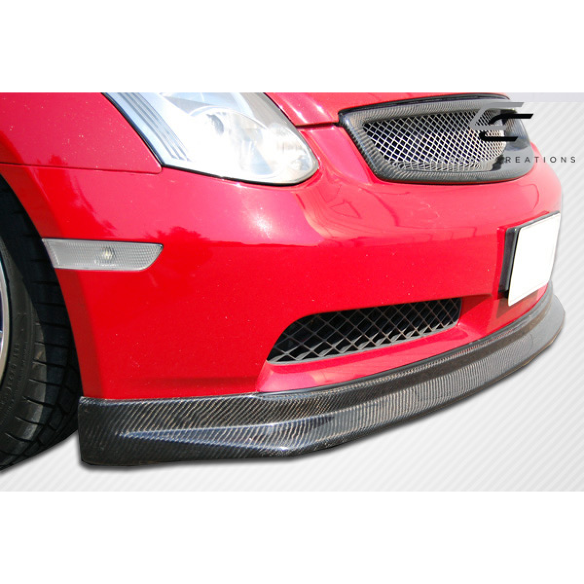 Modify your Infiniti G35 2003 with our Exterior/Grilles - The image shows a low front angle of the vehicle