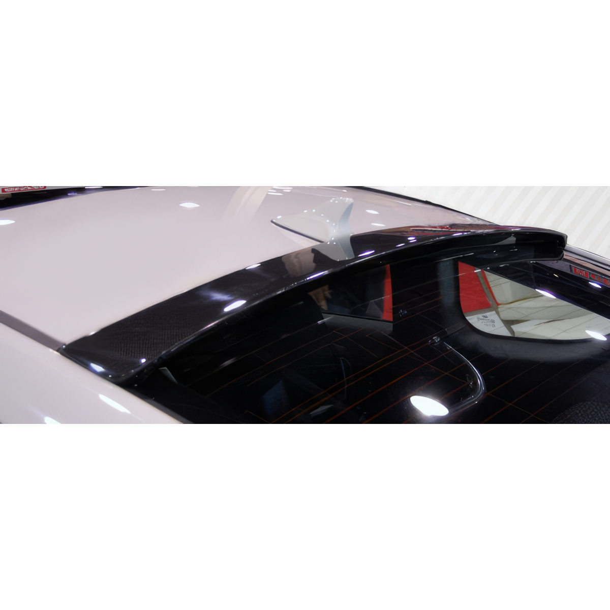 Modify your Hyundai Genesis 2010 with our Exterior/Wings - Angled view from above showcasing roof wing spoiler