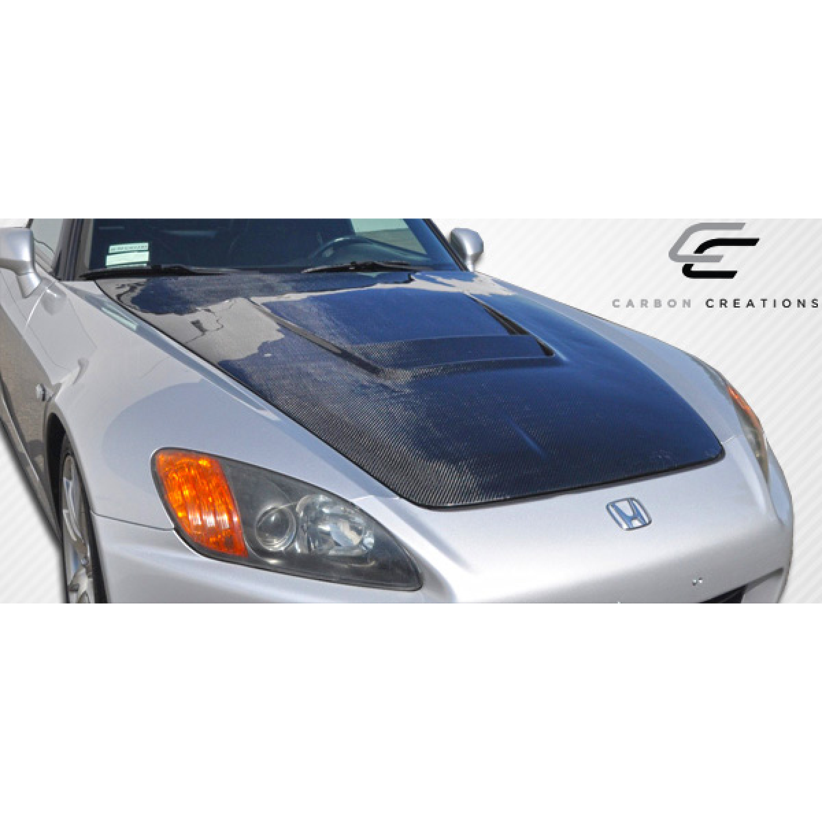 Modify your Honda S2000 2000 with our Exterior/Hoods - The part is viewed from a three-quarter angle