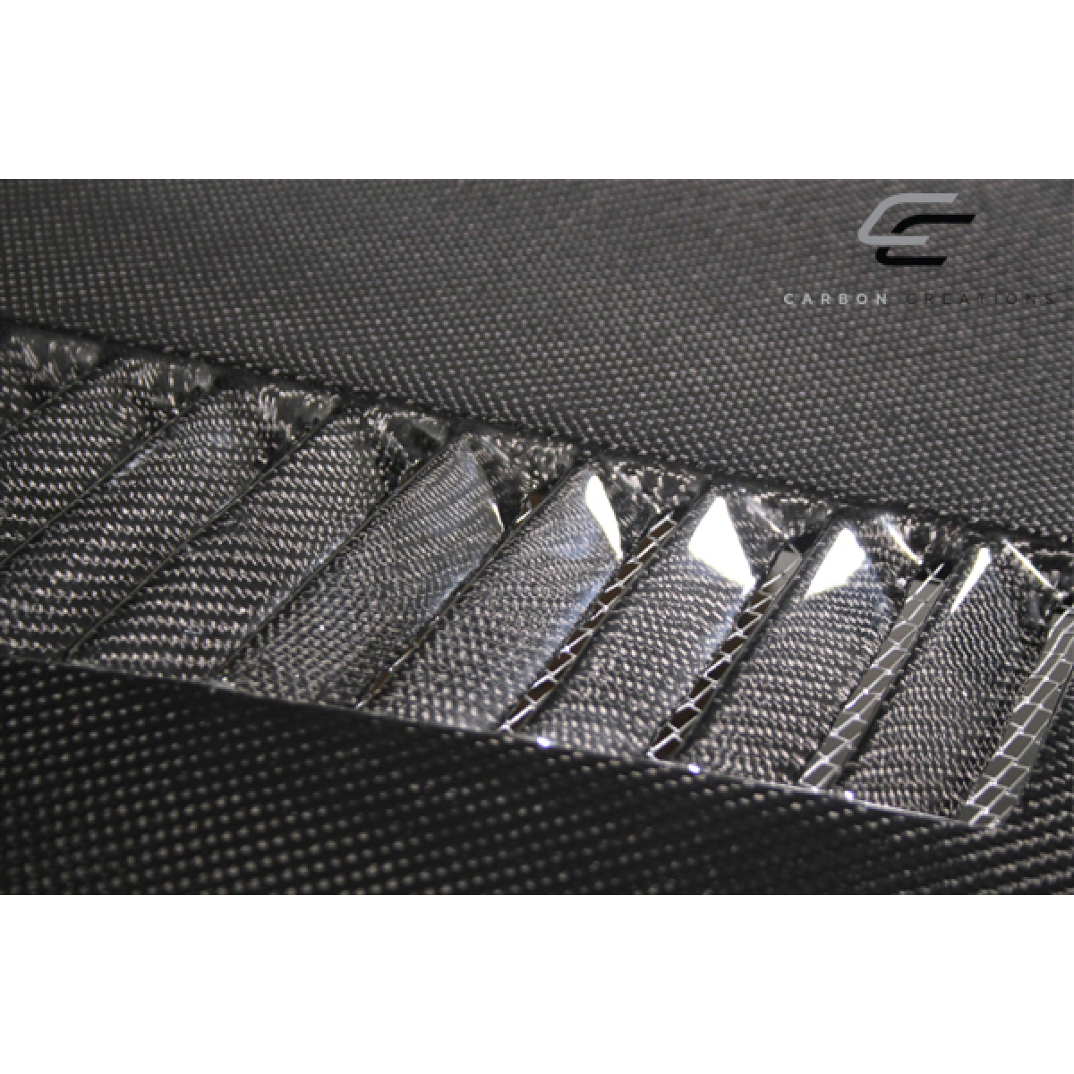 Modify your Ford Mustang 2005 with our Exterior/Hoods - Angled view showcasing carbon fiber texture and design