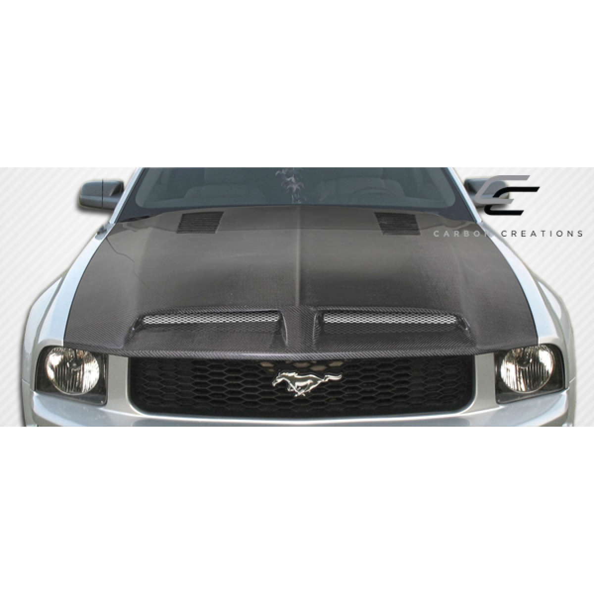 Modify your Ford Mustang 2005 with our Exterior/Hoods - Front view of the carbon fiber hood at an angle