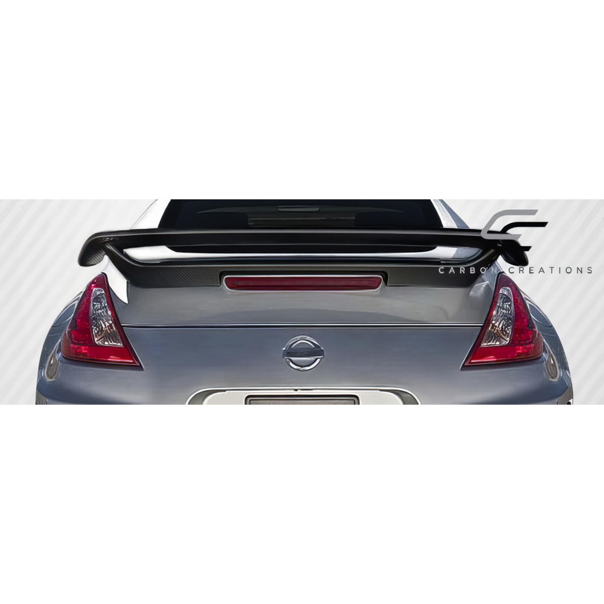 Modify your Nissan 370Z 2009 with our Exterior/Wings - Rear view angle showcasing carbon fiber wing