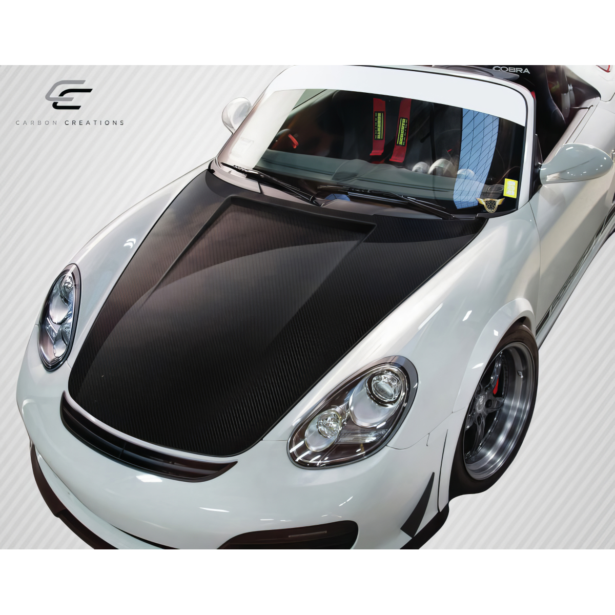 Modify your Porsche 911 2006 with our Exterior/Hoods - Top down view of car hood at a slight angle