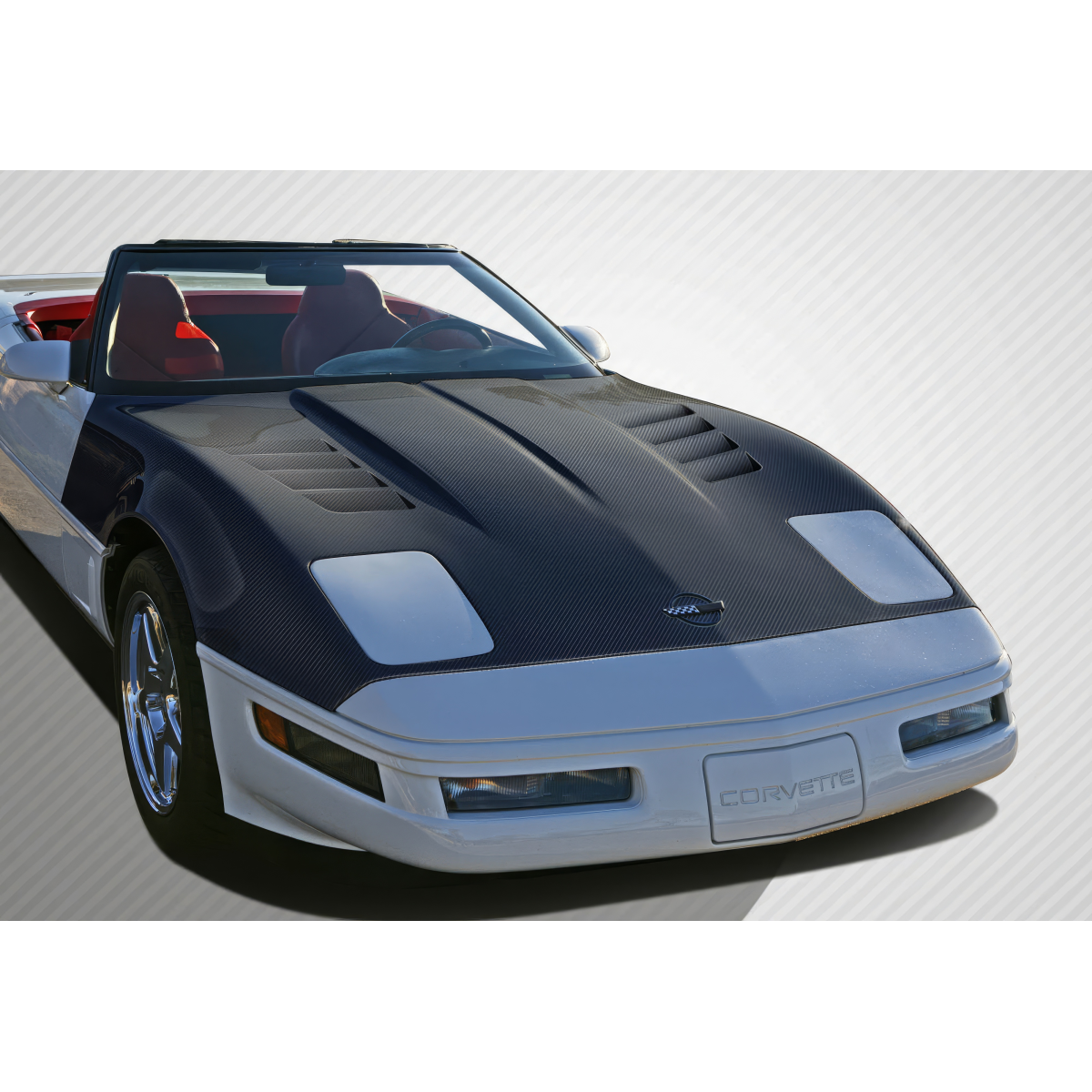 Modify your Chevrolet Corvette 1985 with our Exterior/Hoods - Front angled view of a carbon fiber hood