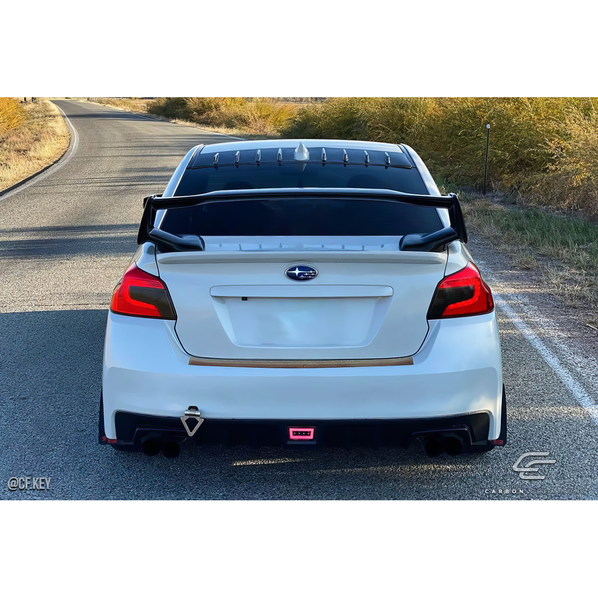 Modify your Subaru Impreza 2008 with our Exterior/Wings - Rear view at a level angle on a road