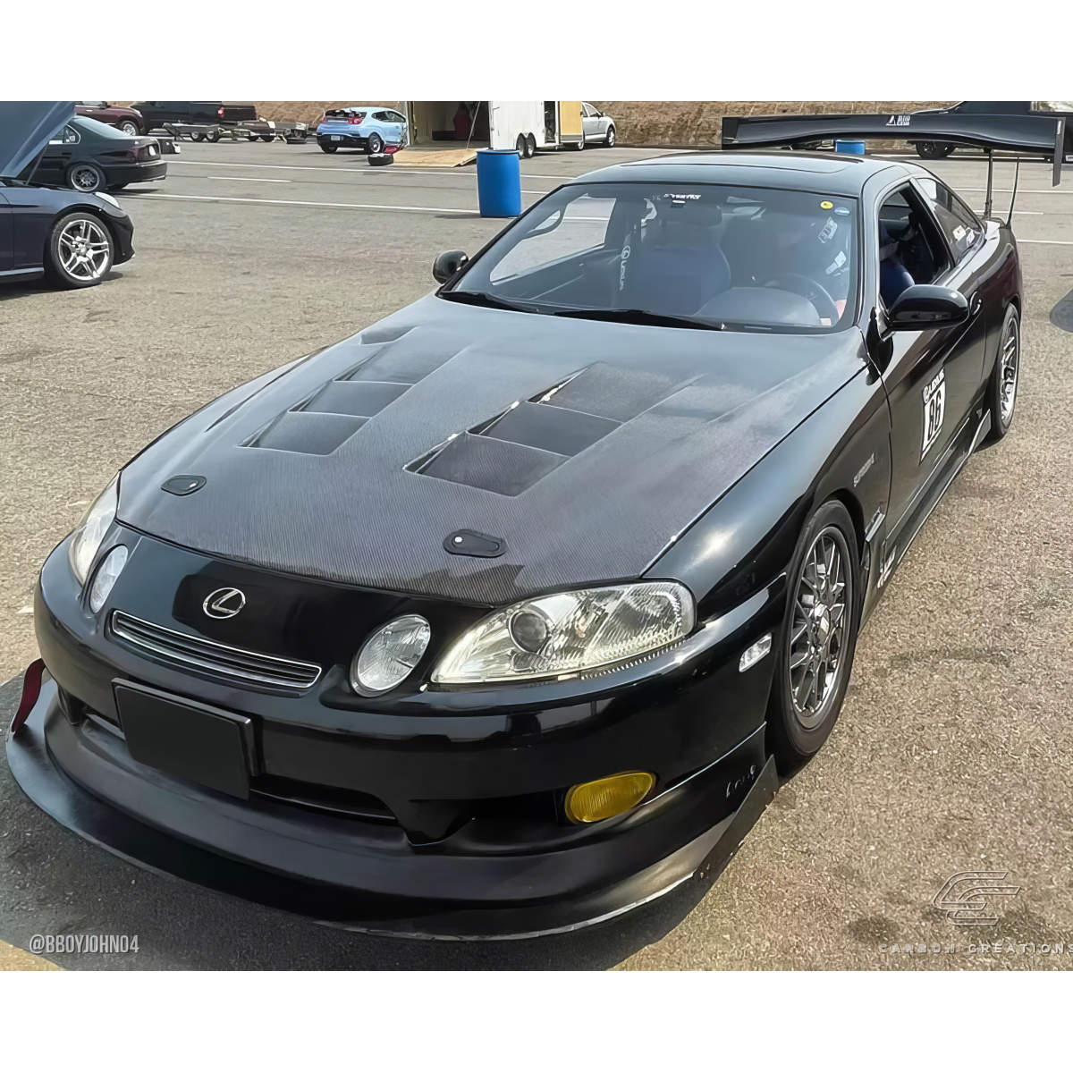 Modify your Lexus SC300 1992 with our Exterior/Hoods - Front three quarter view of carbon fiber hood