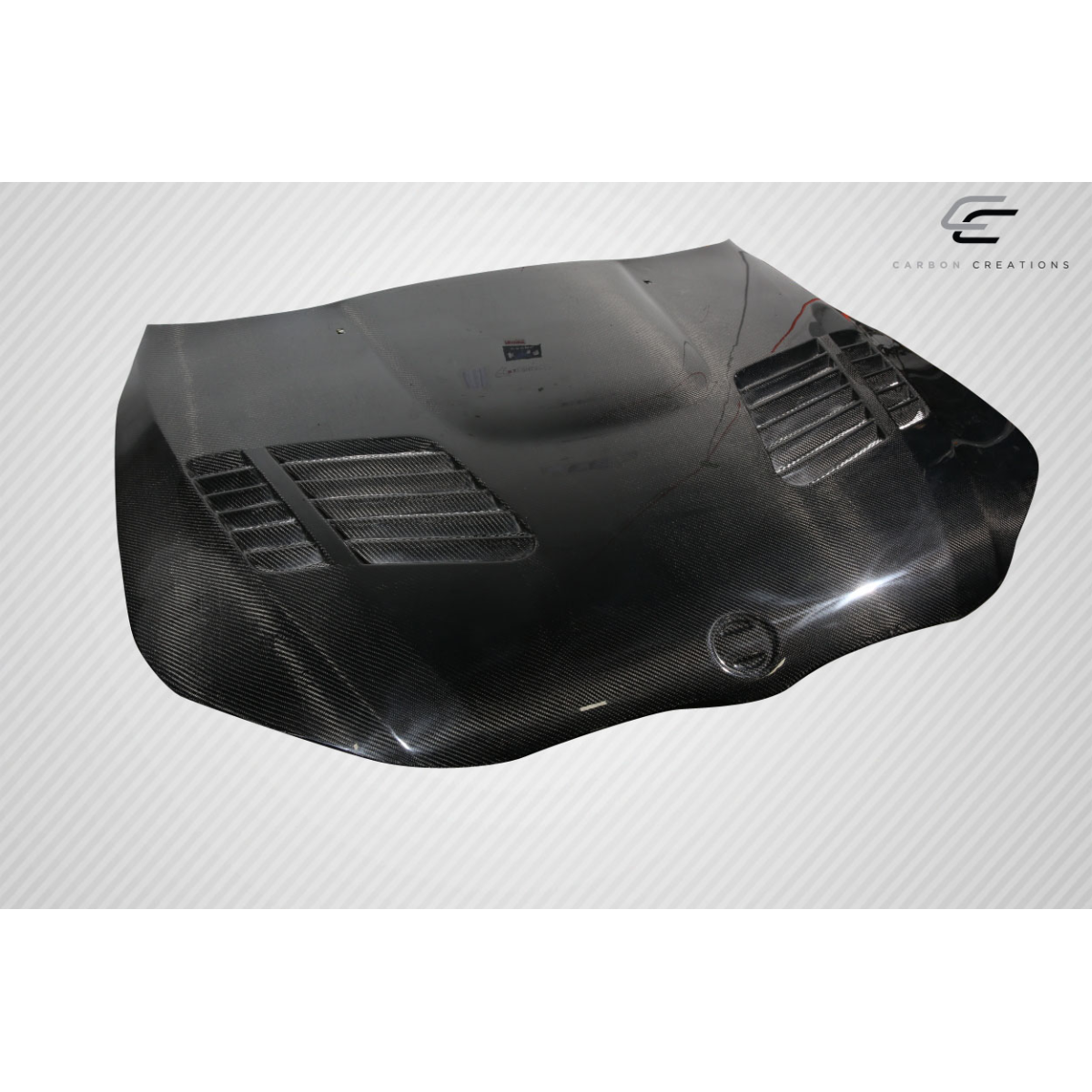 Modify your BMW 5-Series 2004 with our Exterior/Hoods - Top down angle of a carbon fiber hood