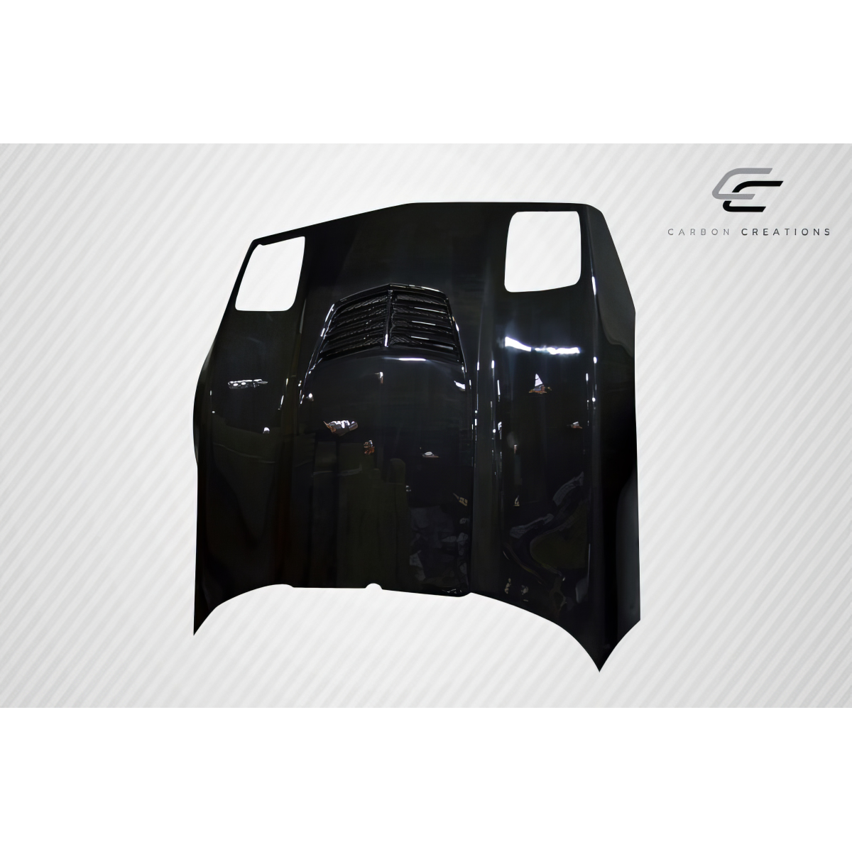 Modify your Chevrolet Corvette 1985 with our Exterior/Hoods - Front view of carbon fiber hood at a slight angle
