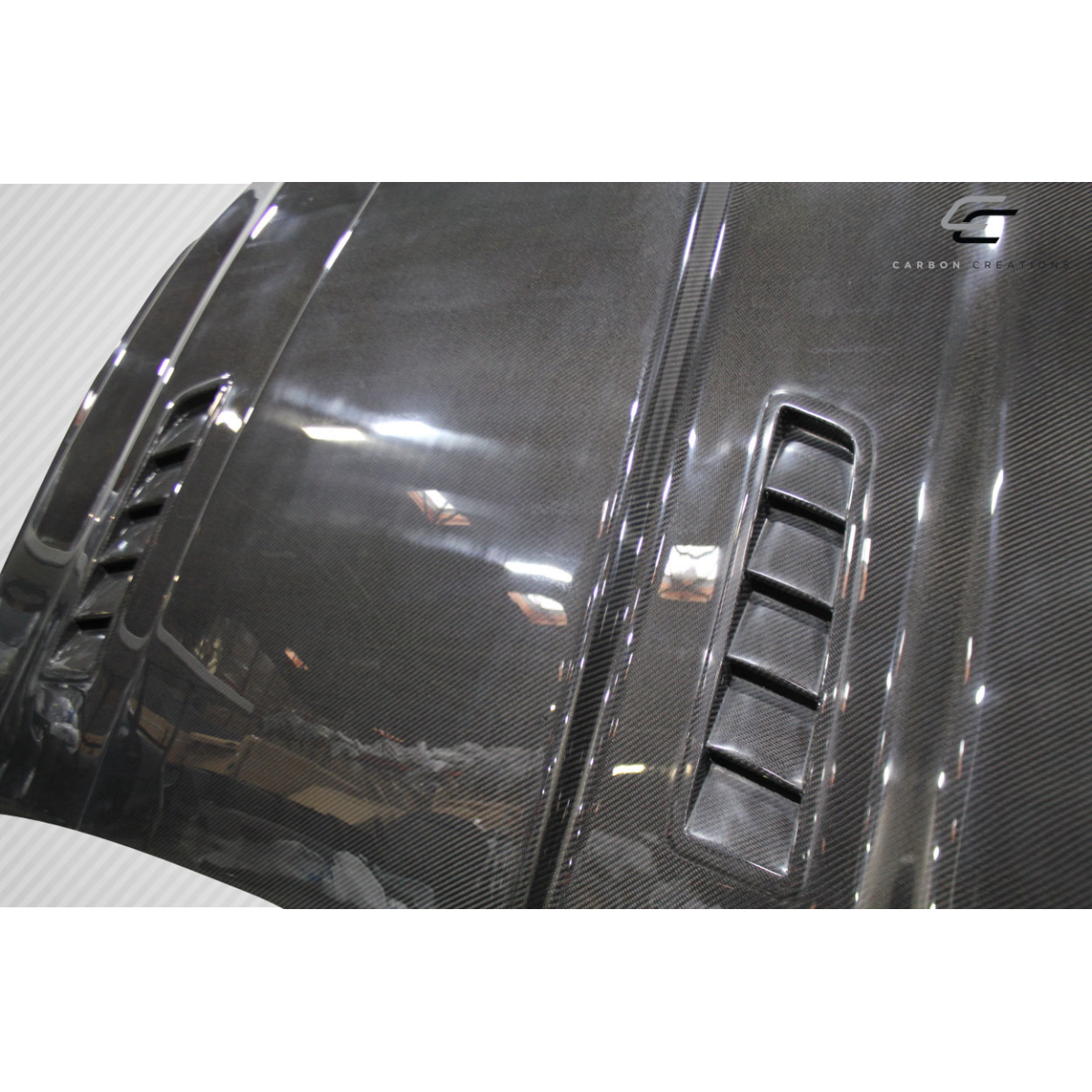 Modify your Ford Mustang 2015 with our Exterior/Hoods - Angled view of carbon fiber hood part