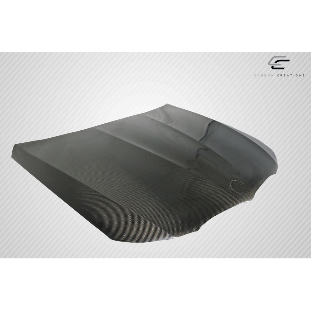 Modify your BMW 3-Series 2009 with our Exterior/Hoods - Angled view of a carbon fiber hood part