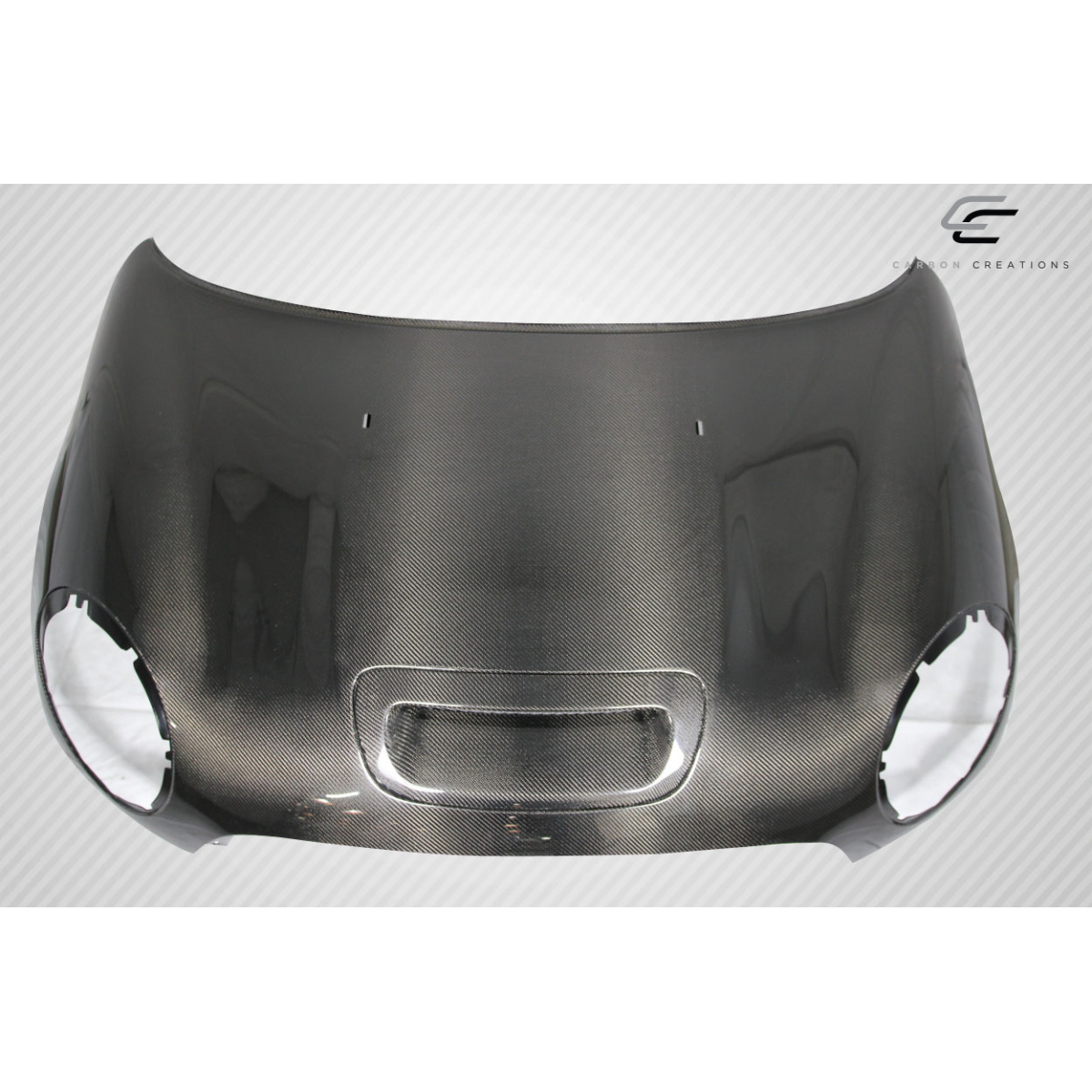 Modify your Mini Cooper 2007 with our Exterior/Hoods - Front view of carbon fiber hood at straight angle