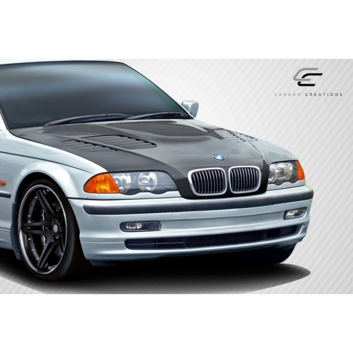 Modify your BMW 3-Series 1999 with our Exterior/Hoods - Front angle showcasing carbon fiber hood