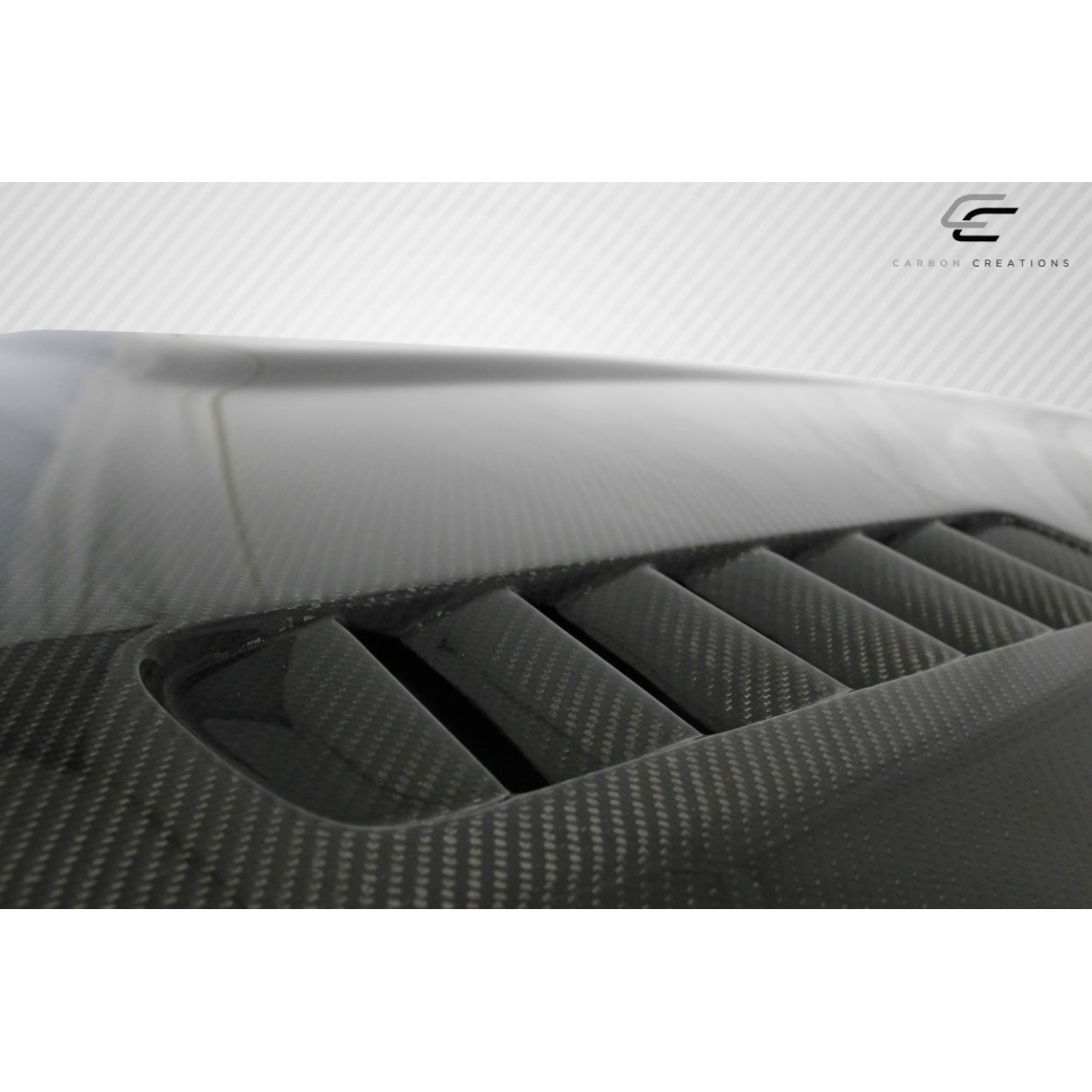 Modify your BMW 5-Series 2004 with our Exterior/Hoods - Angled shot showing carbon fiber detail