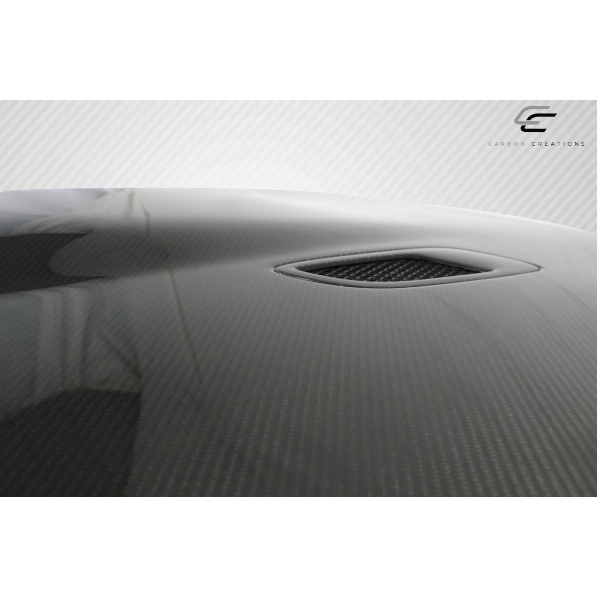 Modify your BMW 3-Series 2006 with our Exterior/Hoods - Top angle view of carbon fiber hood part
